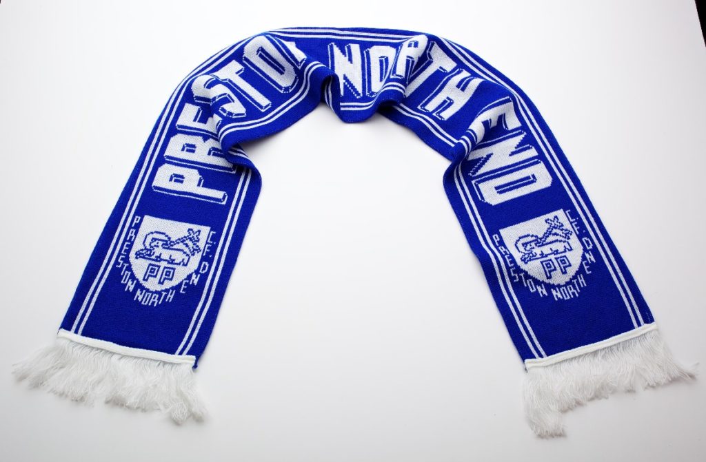 Blue football scarf with the words 'Preston North End' printed across it. Preston Crest (Preston Lamb) also printed in white on it.