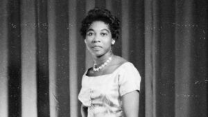 Image of Maxine Grant wearing a dress with pearls
