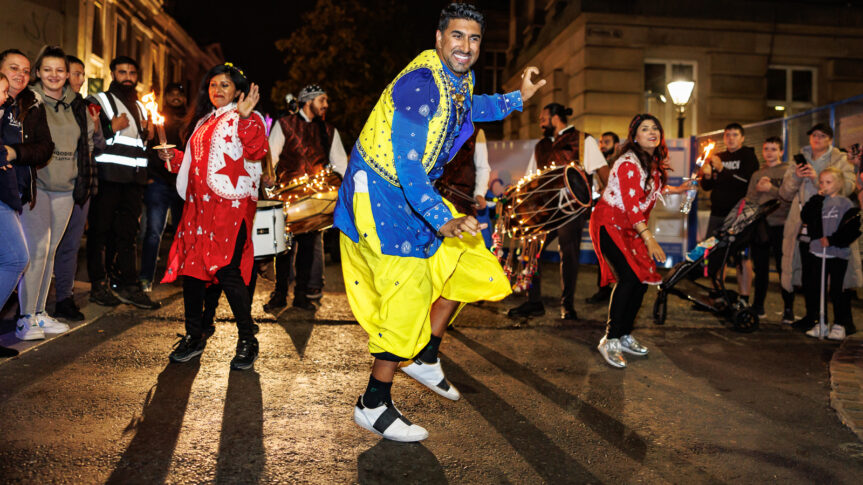 Image of people dancing in the street