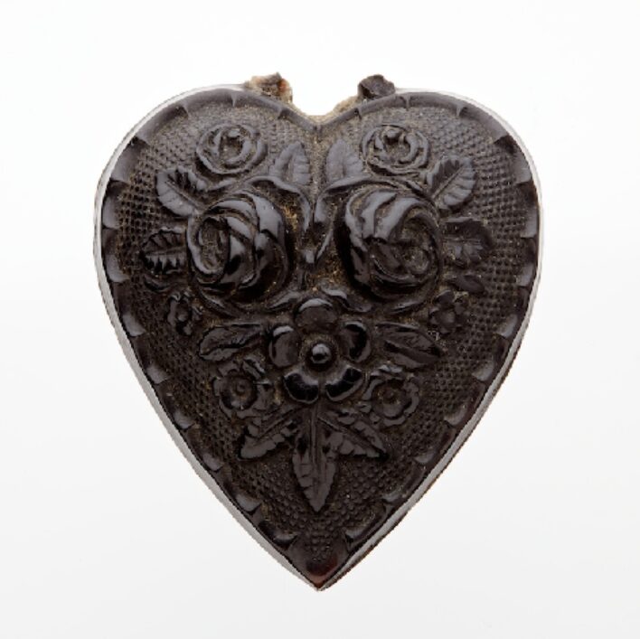 Silver brooch, two hearts above a key and on the left heart inscribed the words ‘Forget me not’.