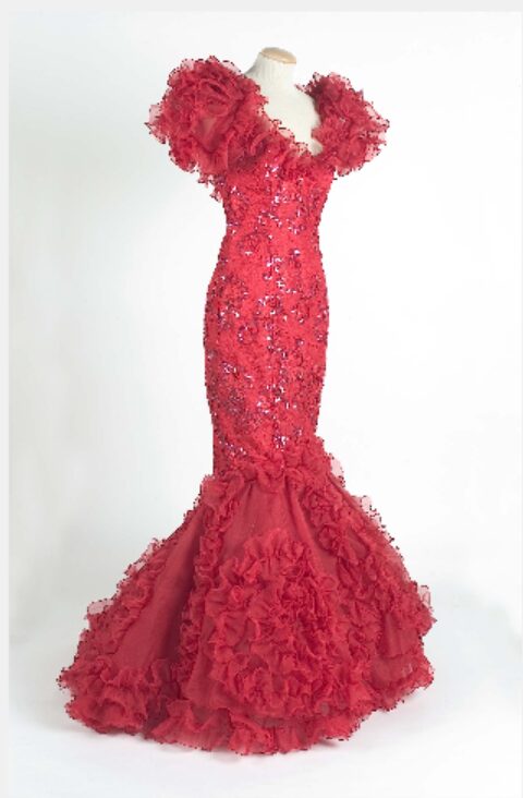 A Flame Red Evening Gown With Off The Shoulder Organza Ruffles.