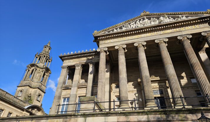 An exterior view of the Harris and Sessions House with blue sky in the background.