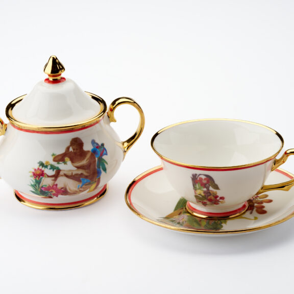 Image of a decorative tea cup, saucer and sugar bowl.