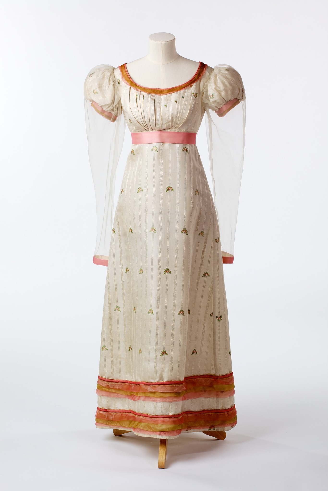 A white brocaded and striped silk gown.