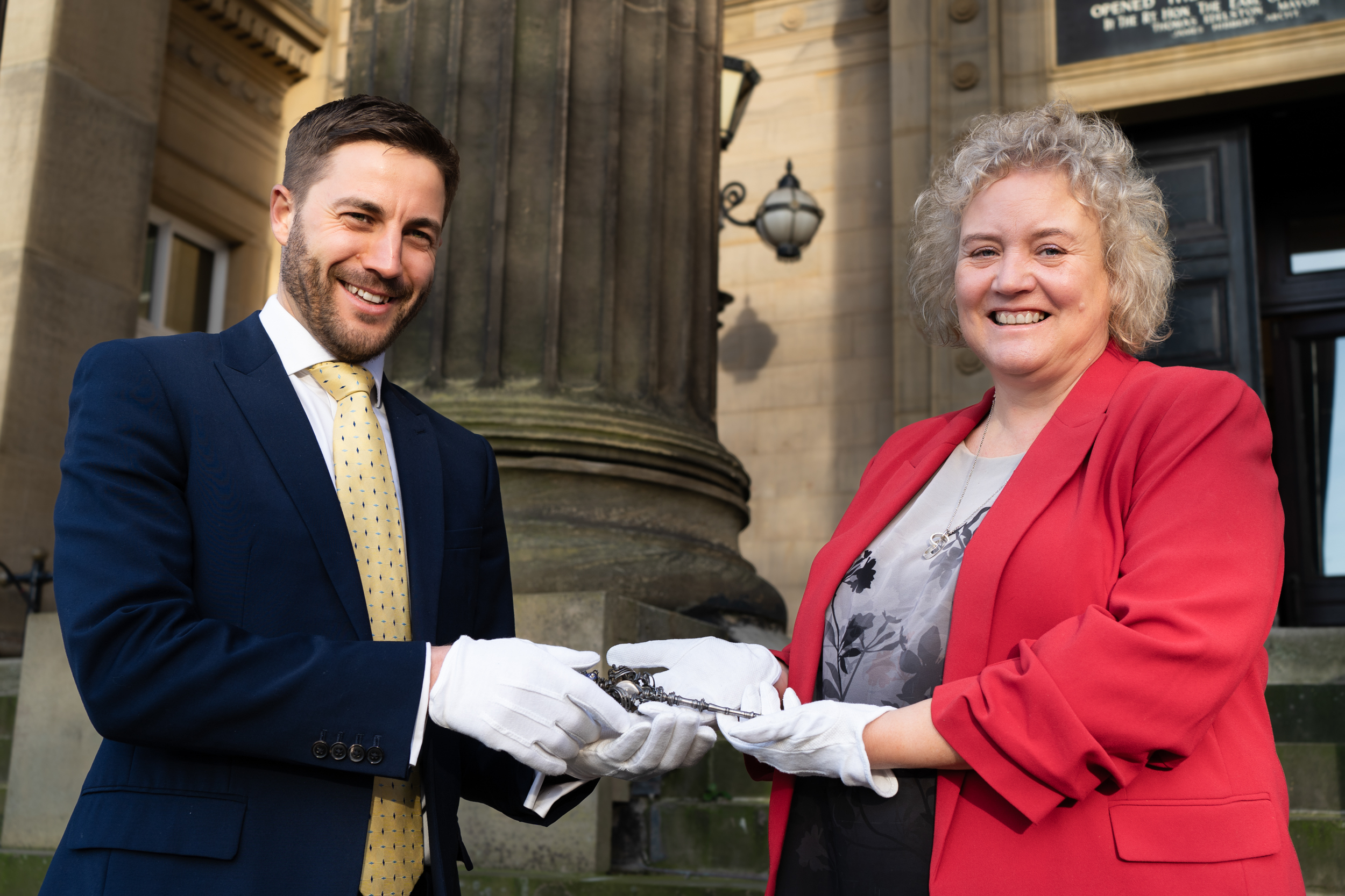 Councillor Anna Hindle, Cabinet Member for Culture and Arts at Preston City Council handing over The Harris ceremonial key to Harry Coughlin, Director, The Hub Consulting Limited.