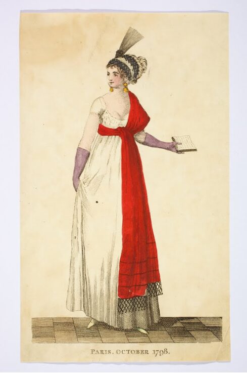 Fashion plate featuring a woman in a white dress with a red shawl, accompanied by the text ‘Paris, October, 1798’