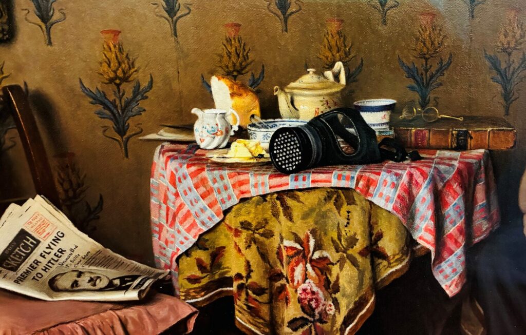 A vintage table setting with a red-checked cloth, a gas mask, old teapot, newspaper, books, and floral wallpaper, conveying a wartime nostalgia.