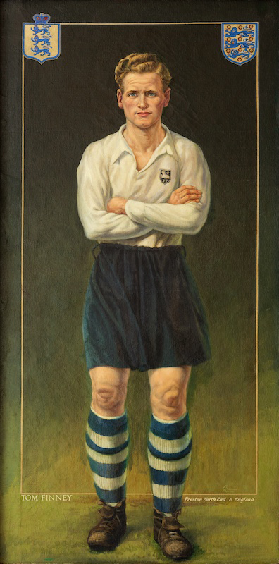 A portrait of a classic soccer player in a white long-sleeve jersey, dark shorts, and striped socks, standing confidently with arms crossed.