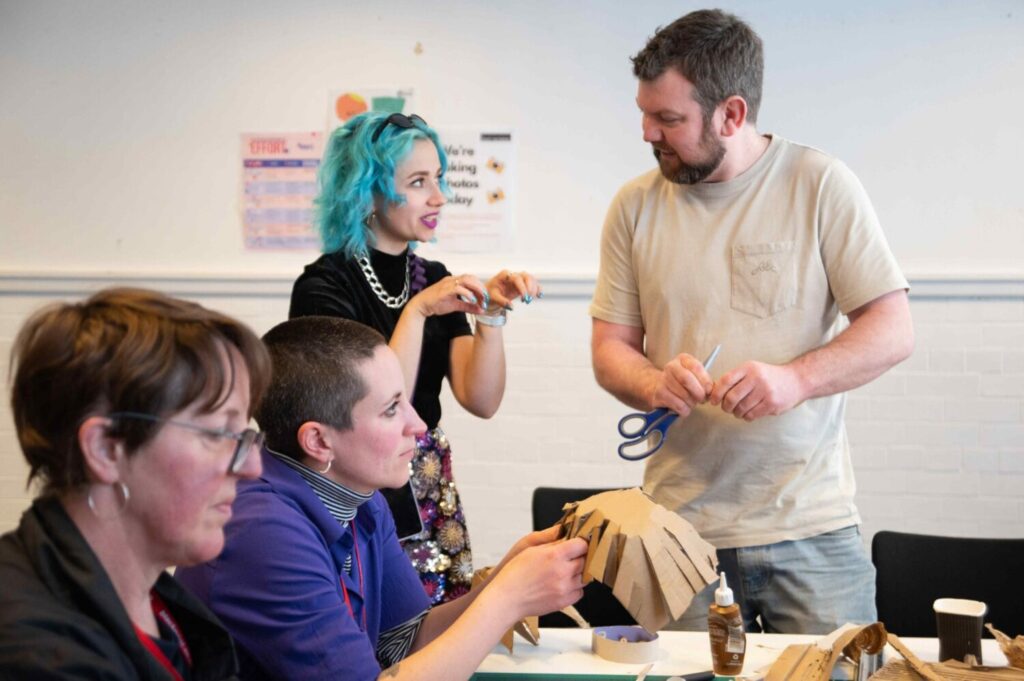 Image of people taking part in a craft workshop.