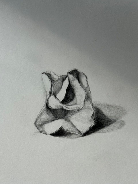 Sketch of a sculpture in a rose shape on paper.