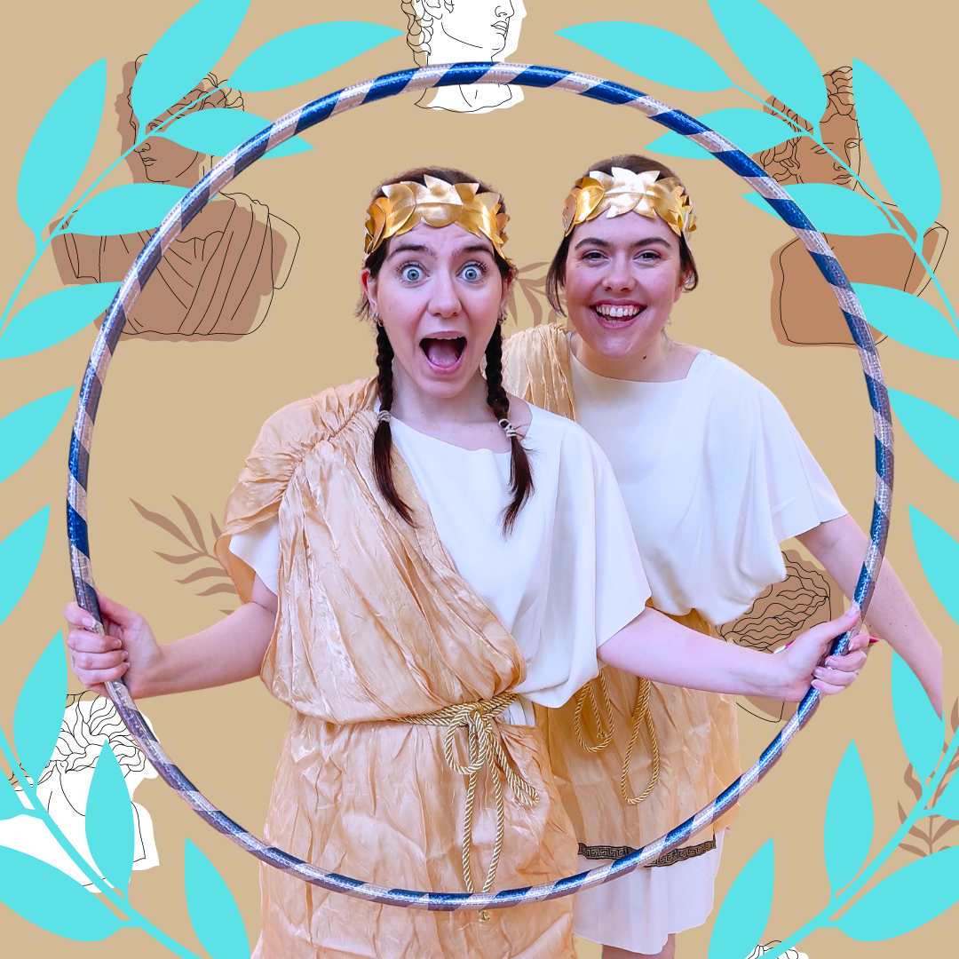 Image of two people wearing gold crowns.