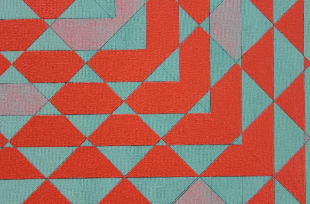 Image of a red and pink patterned artwork.