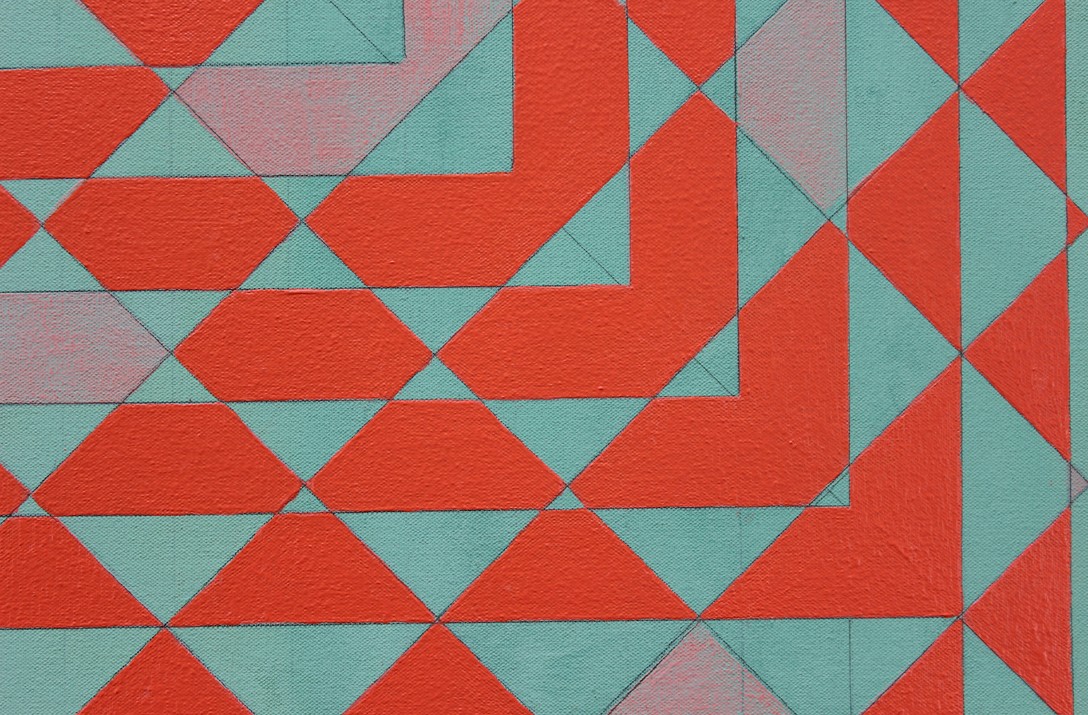 Image of a red and pink patterned artwork.