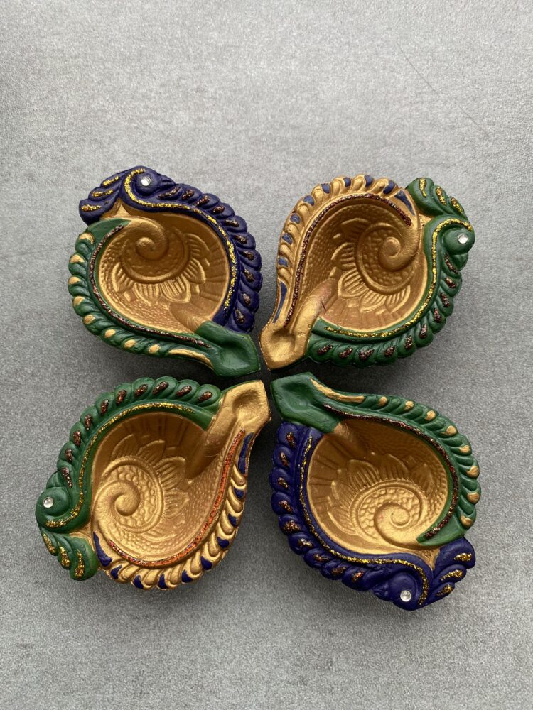 An image of a green and blue Diya decoration
