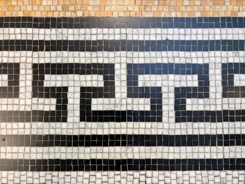 Image of a mosiac tiled floor.