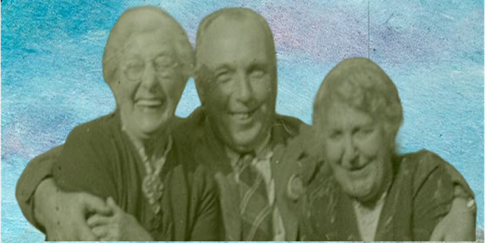 Archive image of three people smiling and laughing on a blue background,