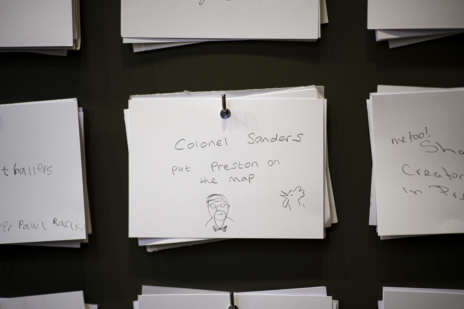 Image of drawings on white cards.