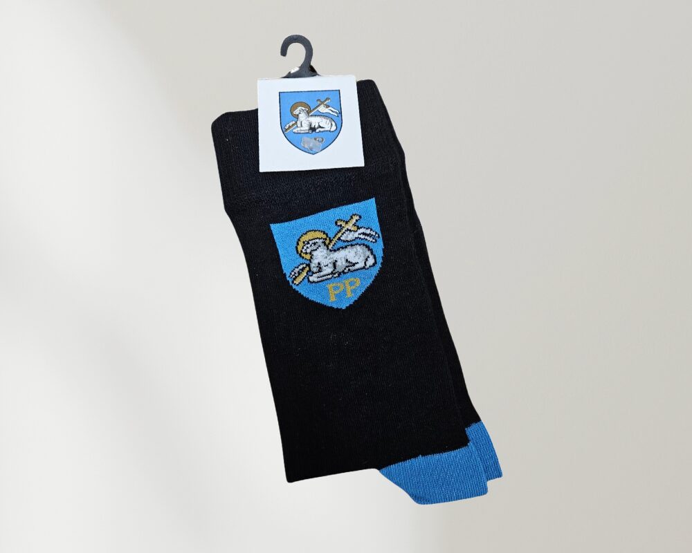 Preston Crest black socks witha blue emblem.