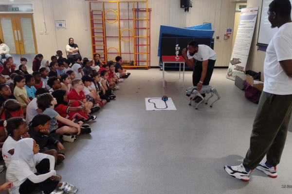 Image taken of a robotics presentation with a school class.