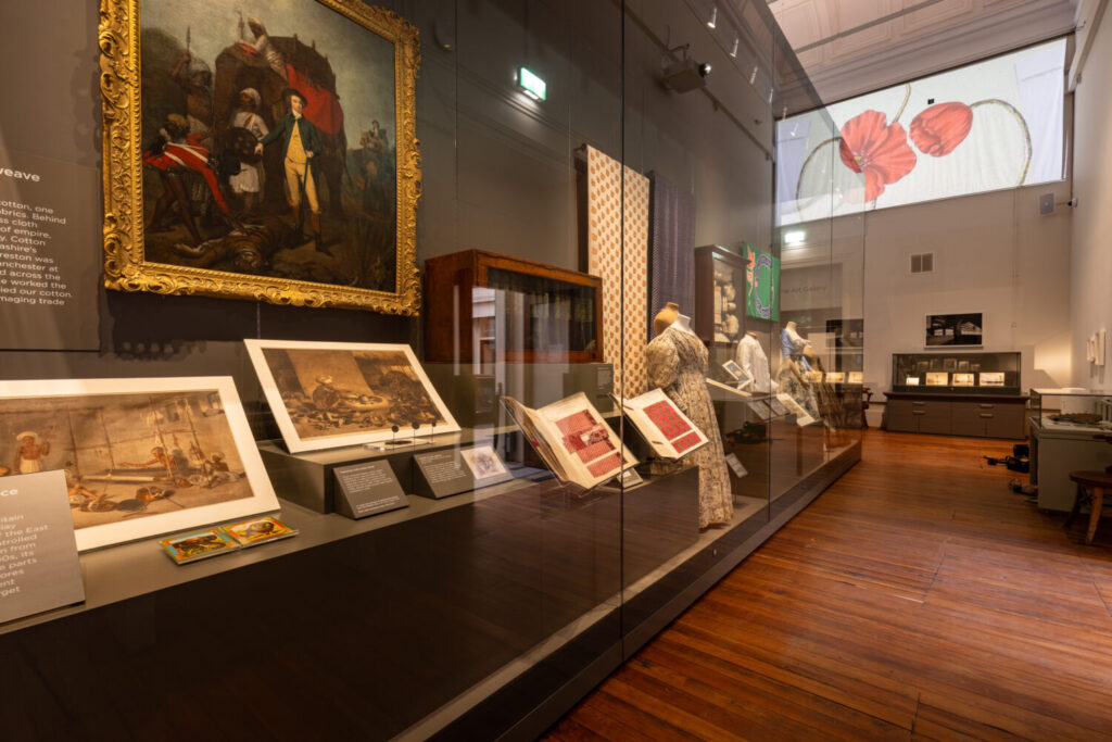 Image of artworks in a glass case.