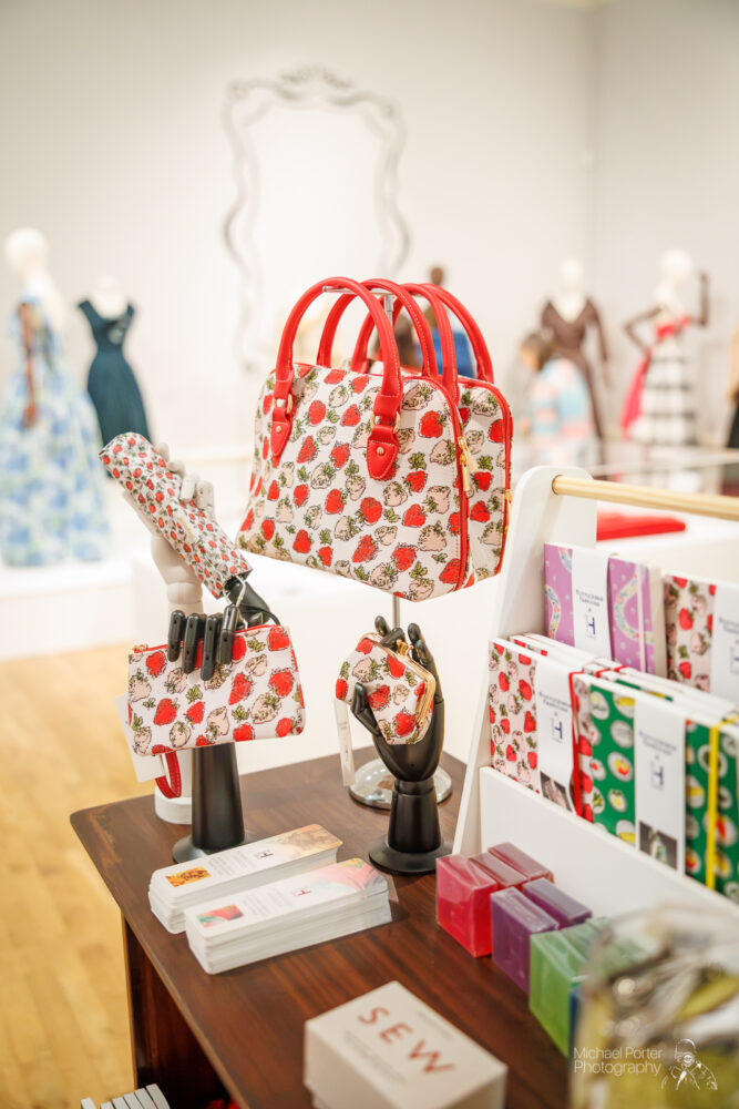 Image of shop items including a handbag and umbrella.