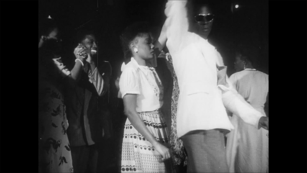 Black and white image of people dancing.